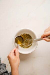 Whisking Italian Dressing and Adding Olive Oil