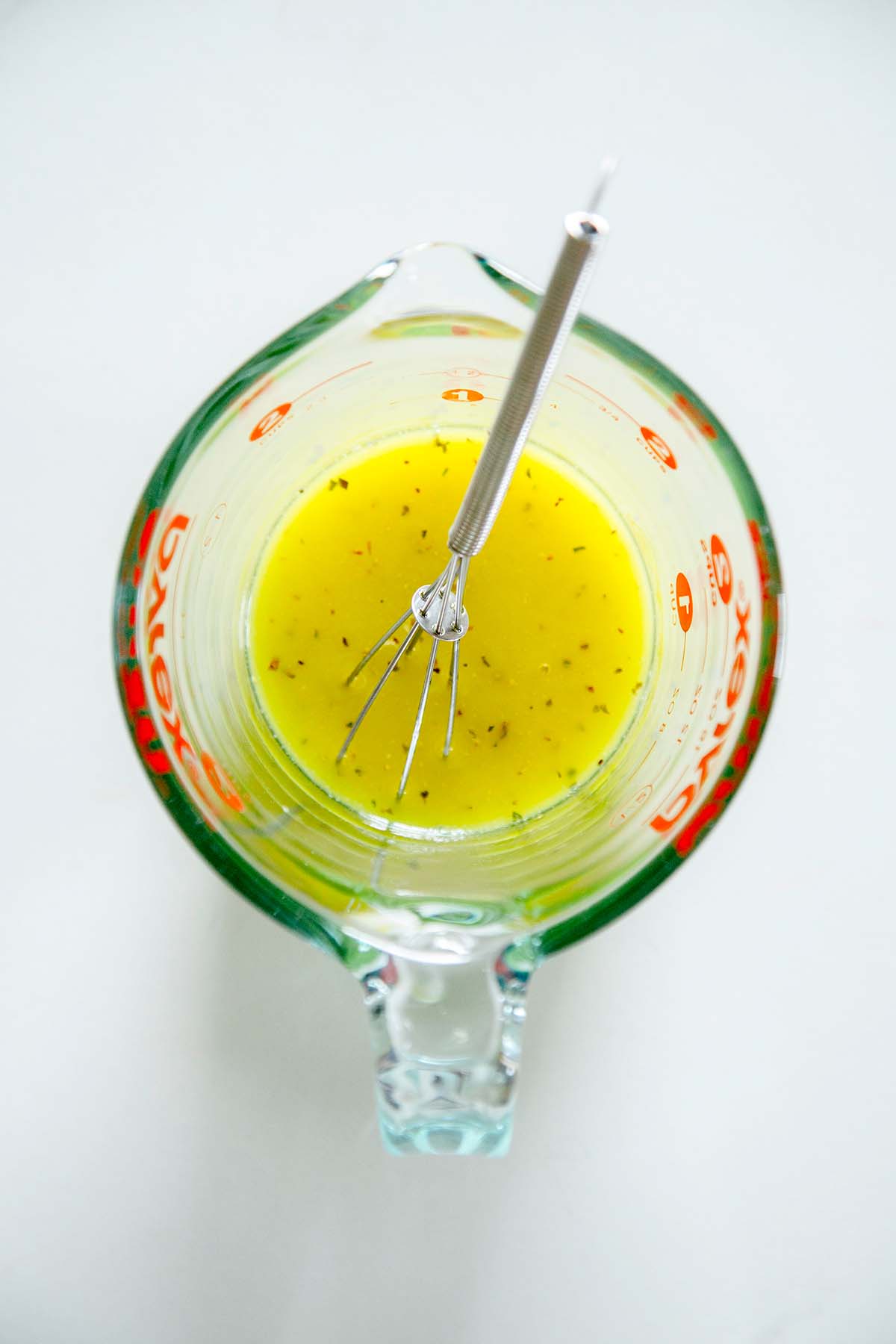 lemon olive oil dressing in pyrex glass