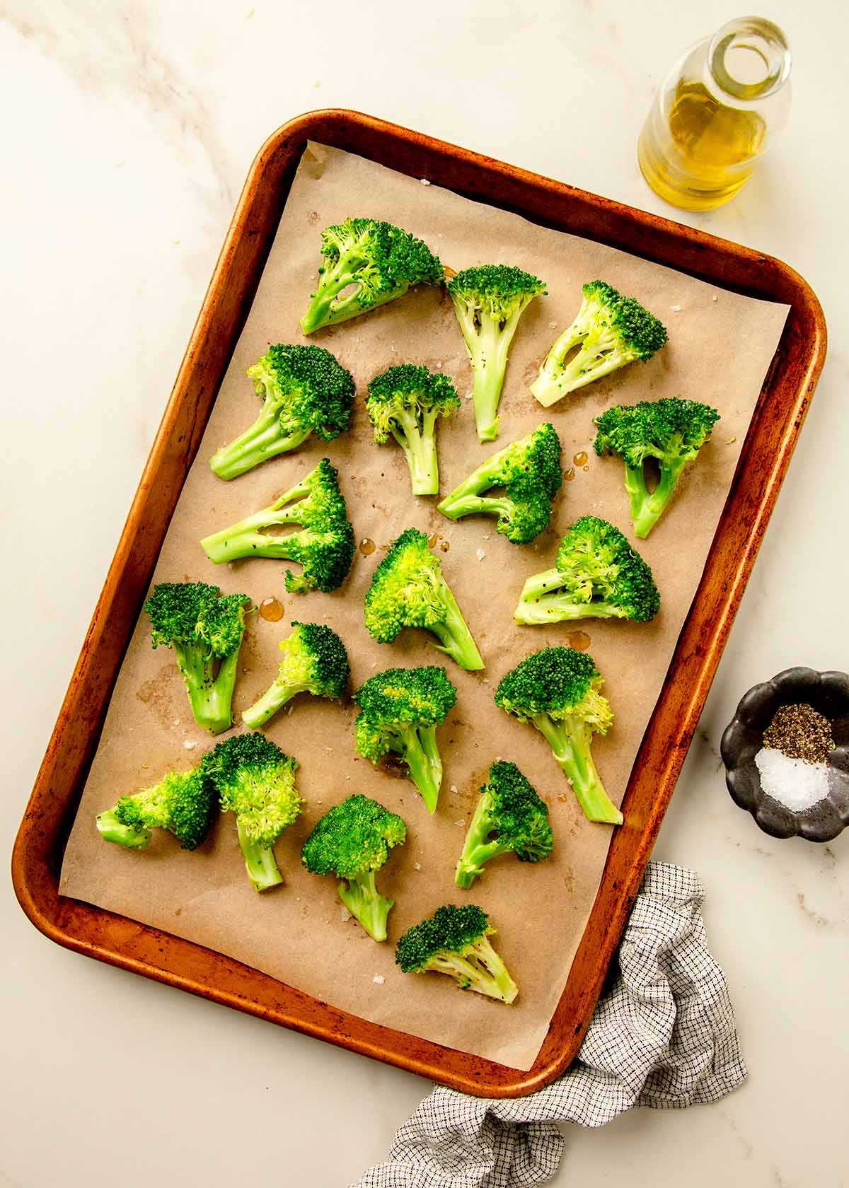 Uncooked broccoli on a sheet pan