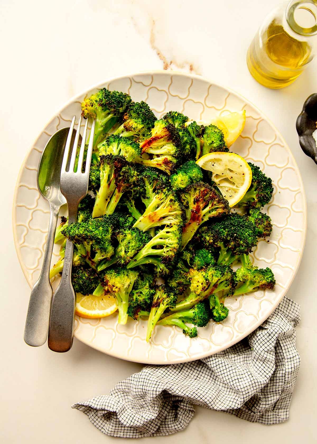 Roasted broccoli on a plate with squeezed lemon
