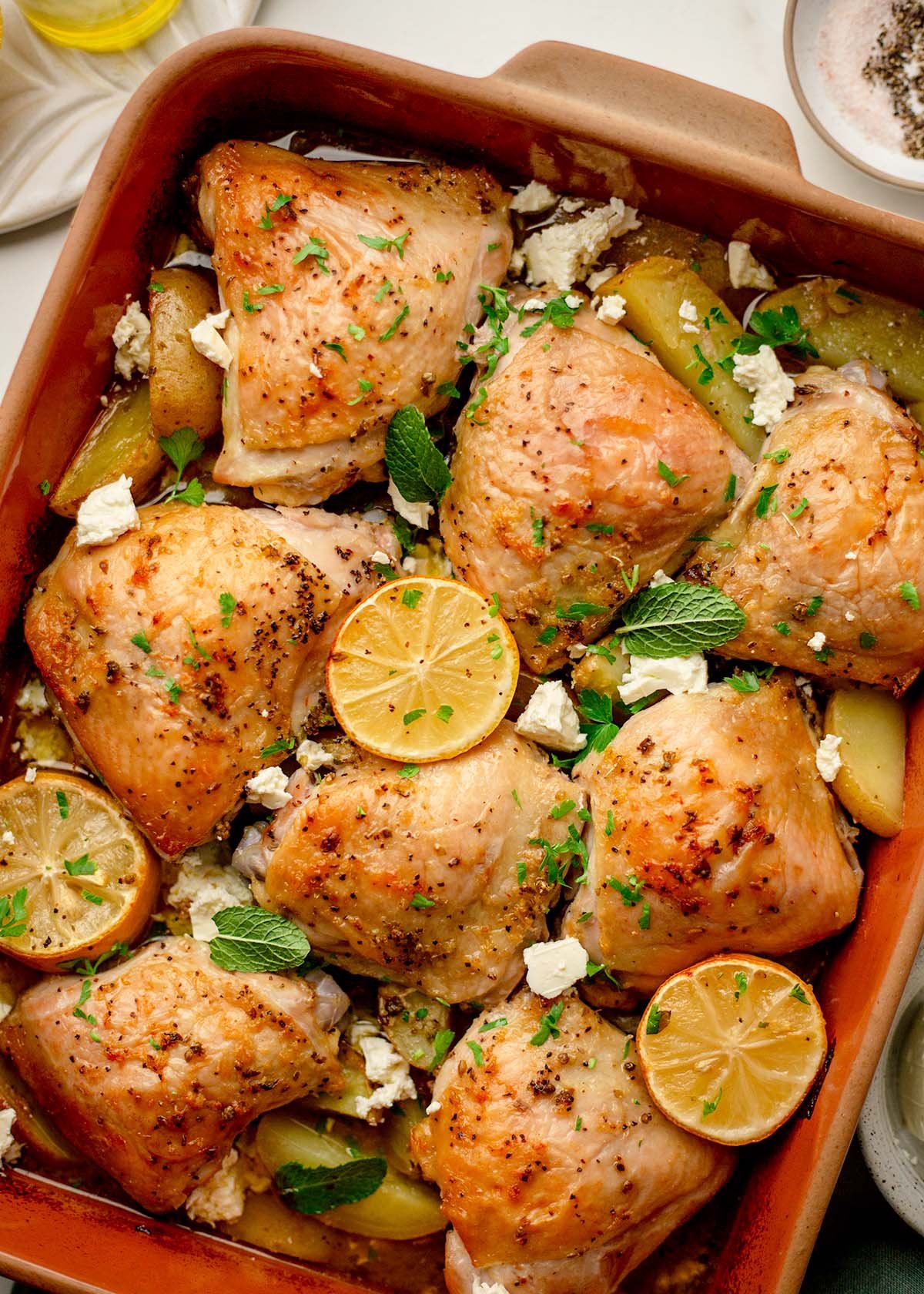Lemon chicken and potatoes in oven