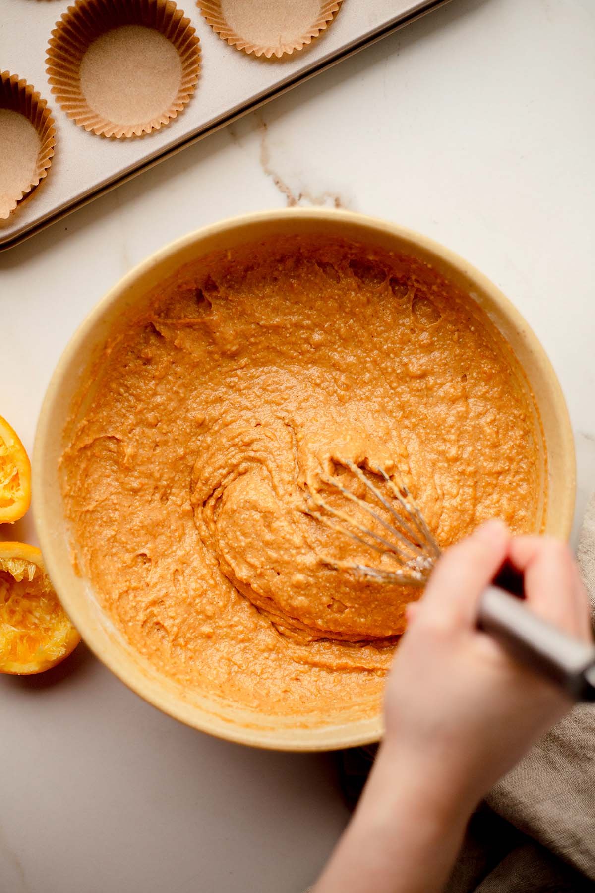 Orange spice pumpkin banana muffins mixing batter