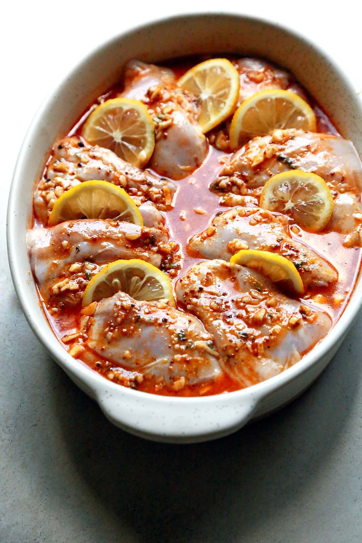 Chicken Thighs in a Baking Dish with Lemon Slice