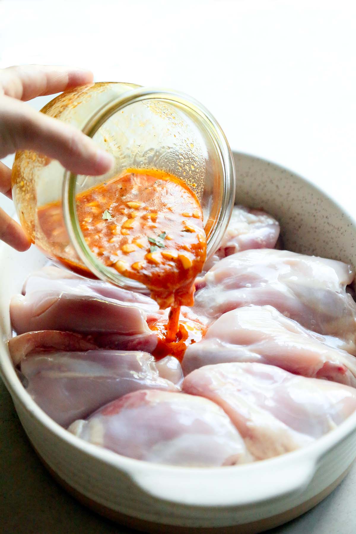 Marinade with Lemon Garlic Poured Over Chicken