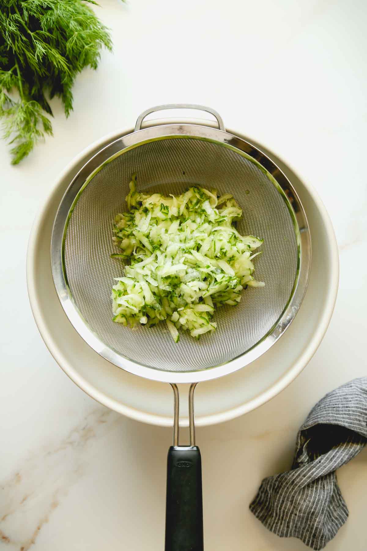 Shredded Cucumber in a Strainer
