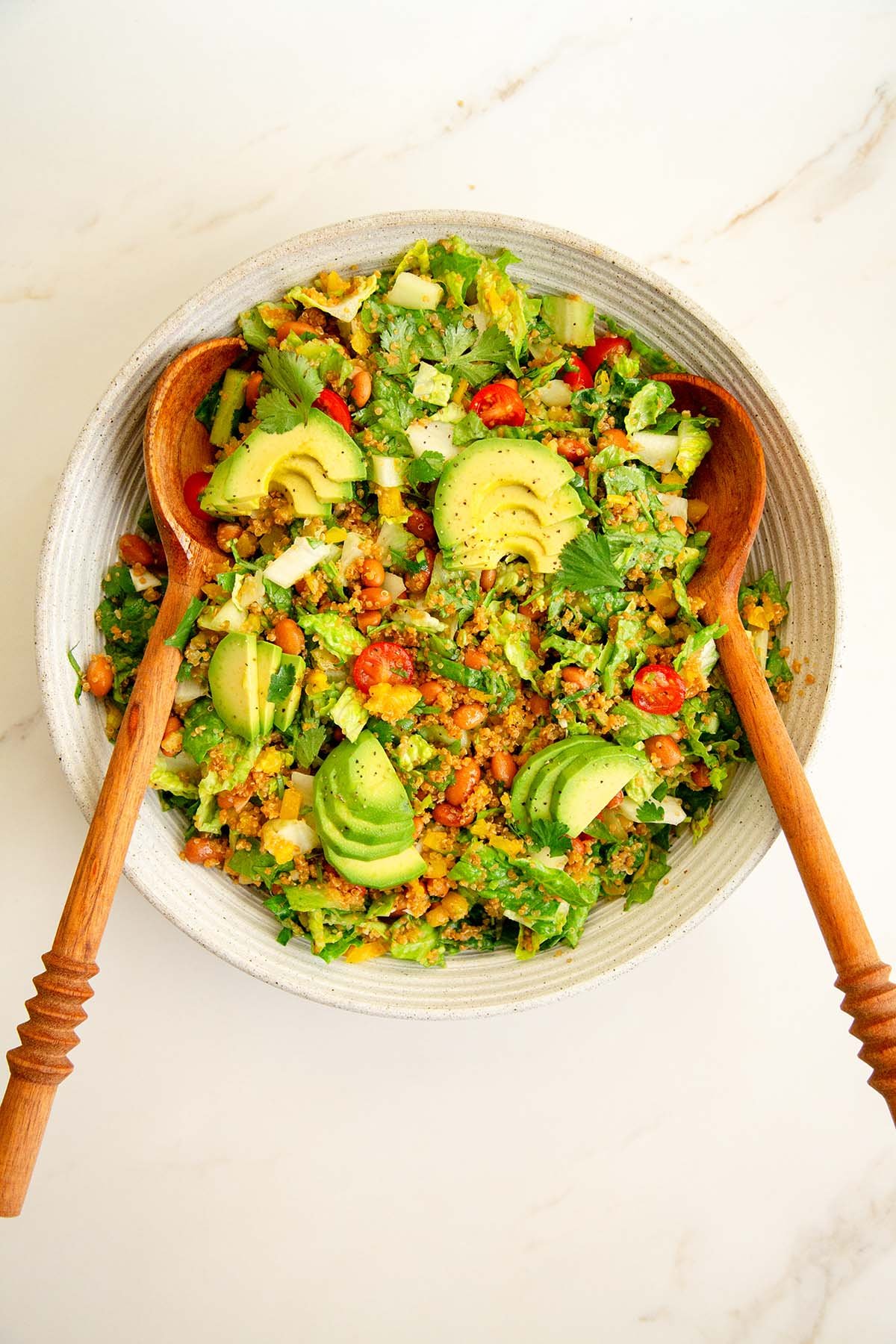 Colorful quinoa salad with taco ingredients and avocado