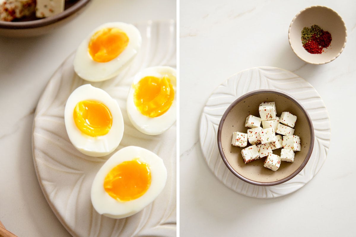 Close-up of soft-boiled eggs with gooey yolks and cubed feta with herbs.