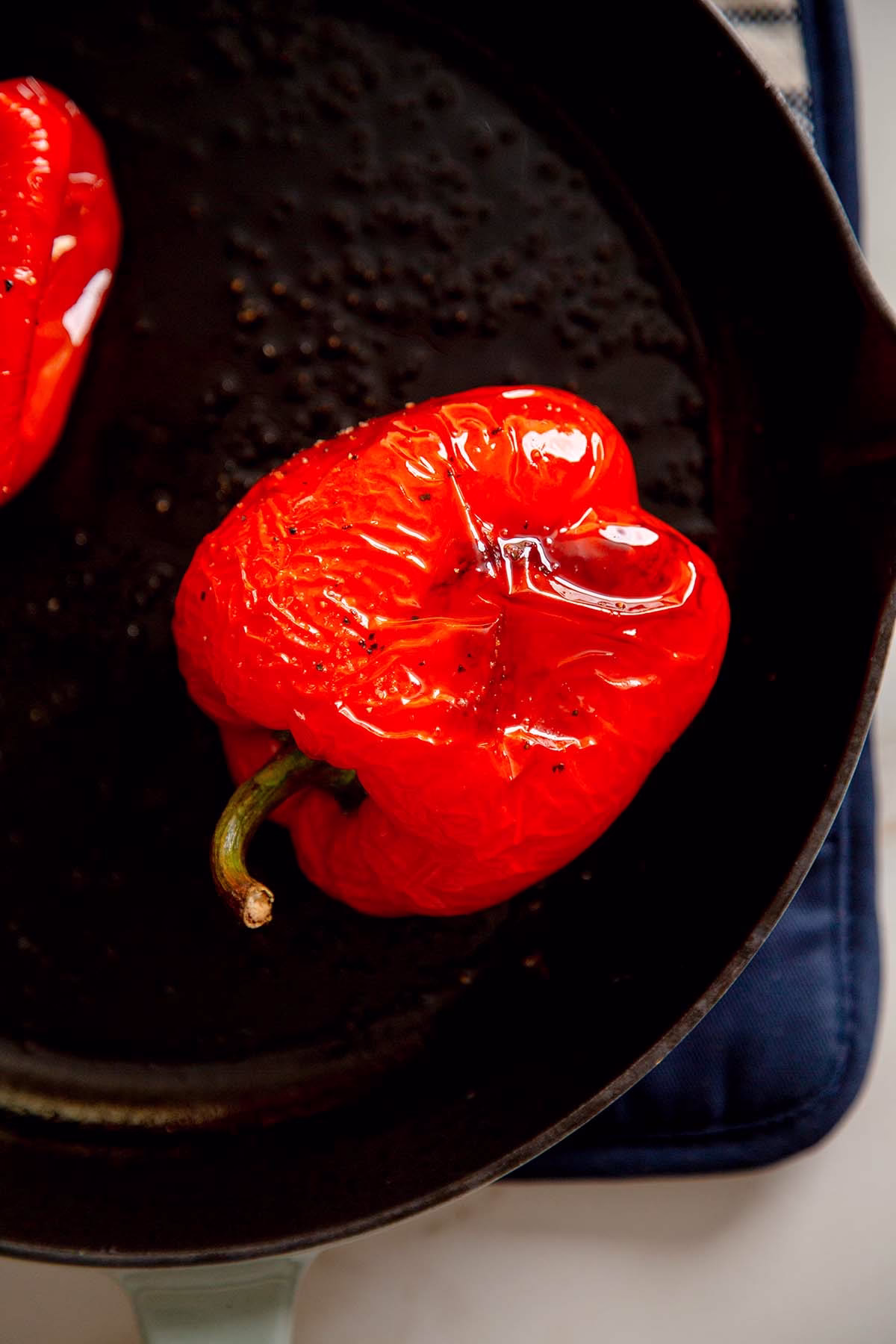 Two Roasted Red Bell Peppers in a Skillet