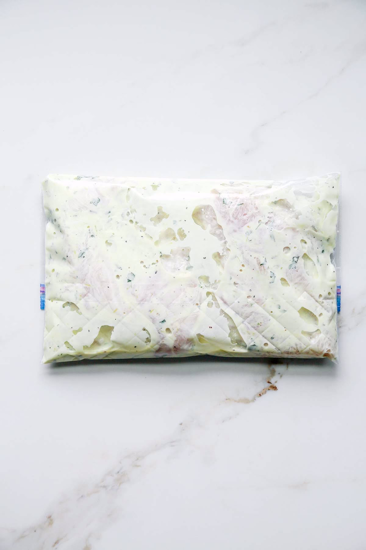 Greek Yogurt with Chicken Marinating in a Ziplock Bag