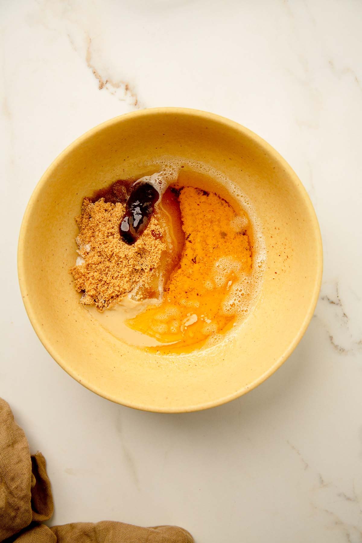 starting with the wet ingredients: brown butter, sugar, vanilla, in a bowl.