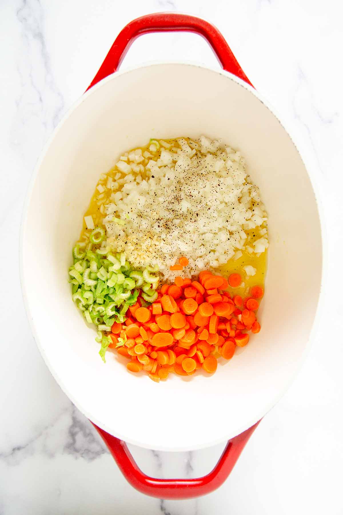 onion, garlic, celery, carrots in a pot