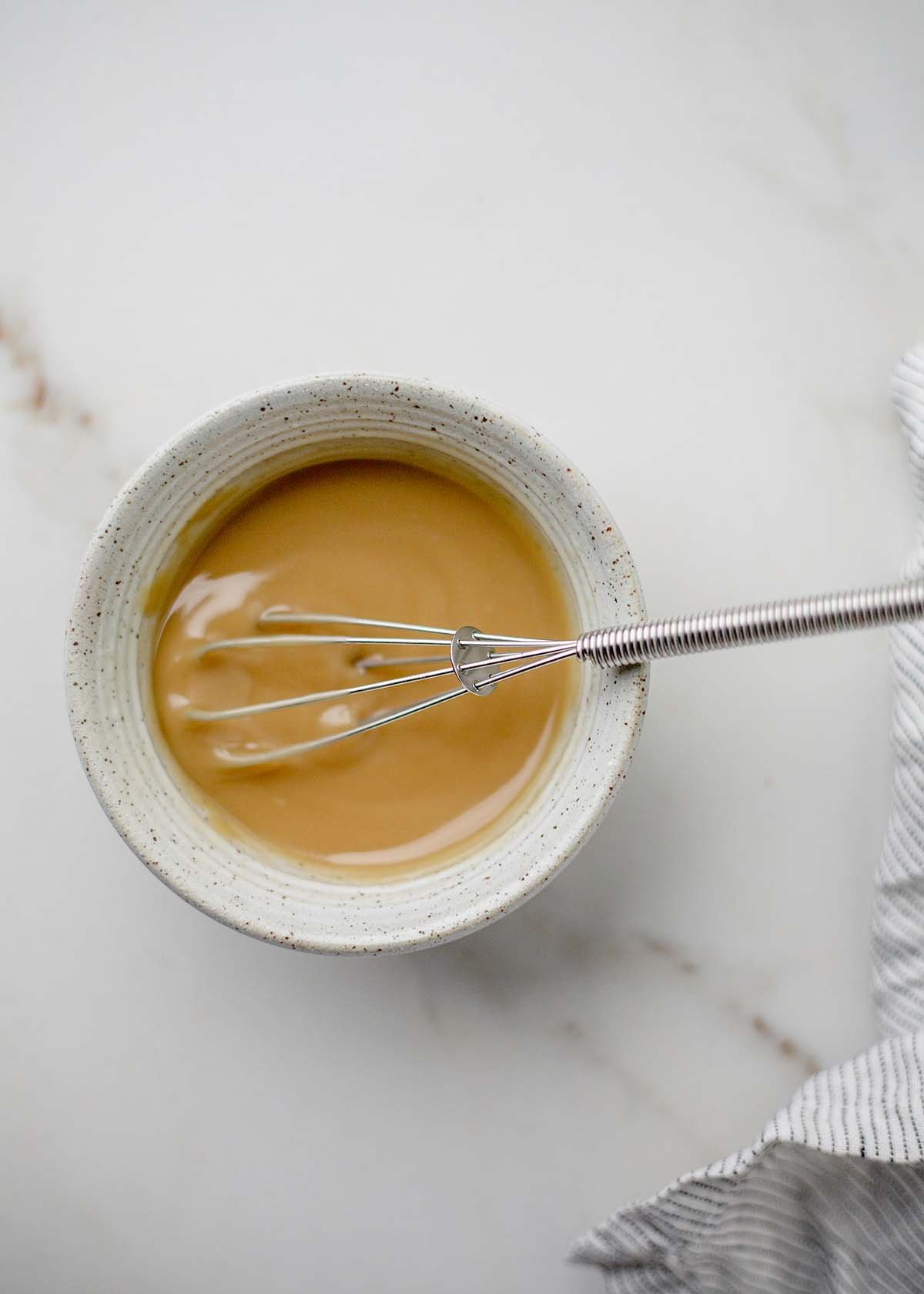 tahini sauce in white bowl