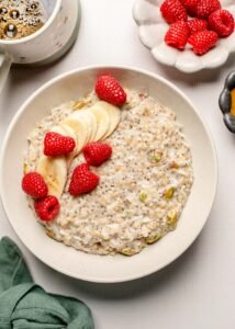 protein oatmeal with fresh raspberries and bananas on top