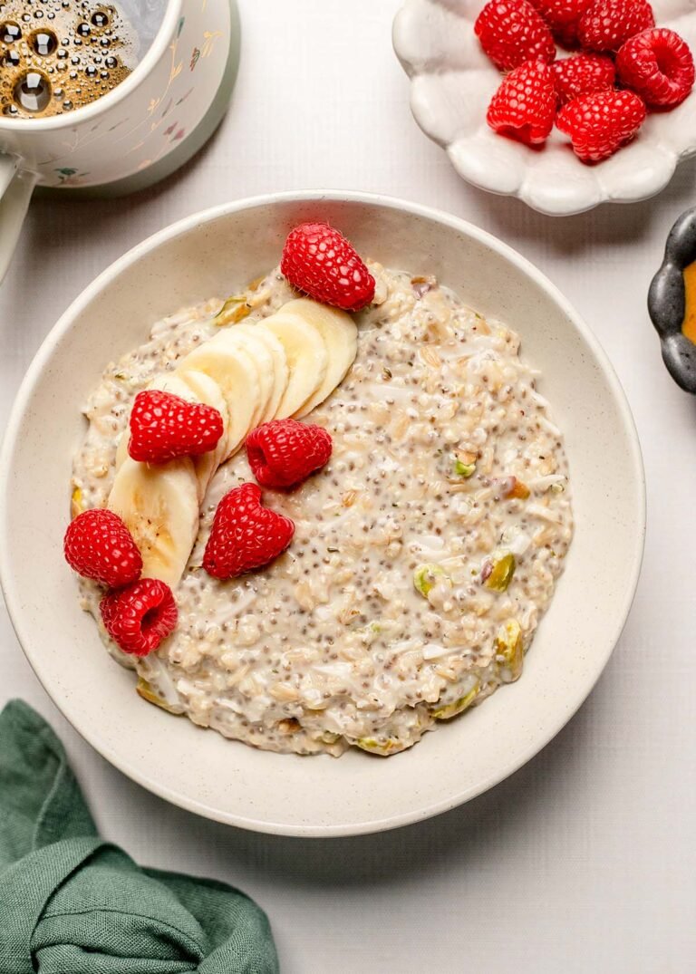 protein oatmeal with fresh raspberries and bananas on top