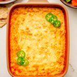 Serving high protein buffalo chicken dip with veggie dippers