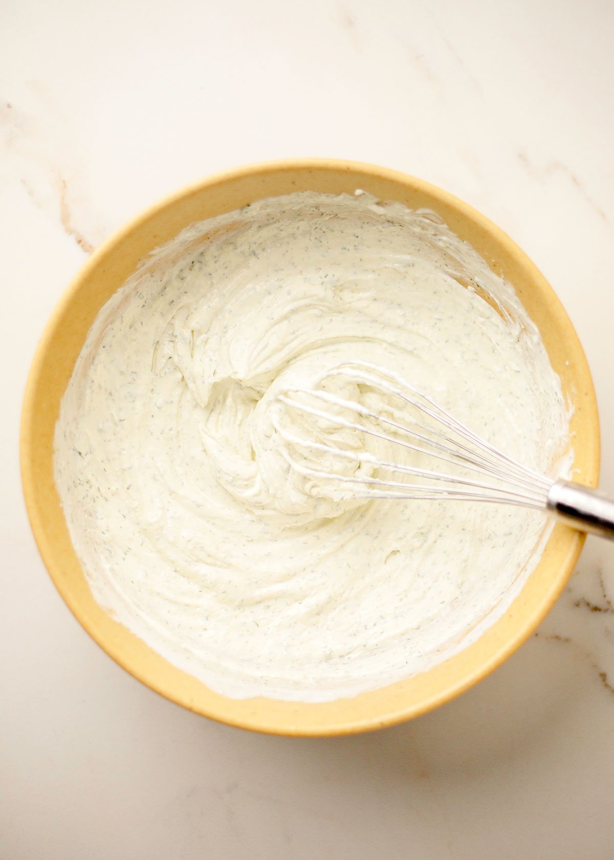 Smooth cream cheese and Greek yogurt mixture forming the creamy base of high protein buffalo chicken dip