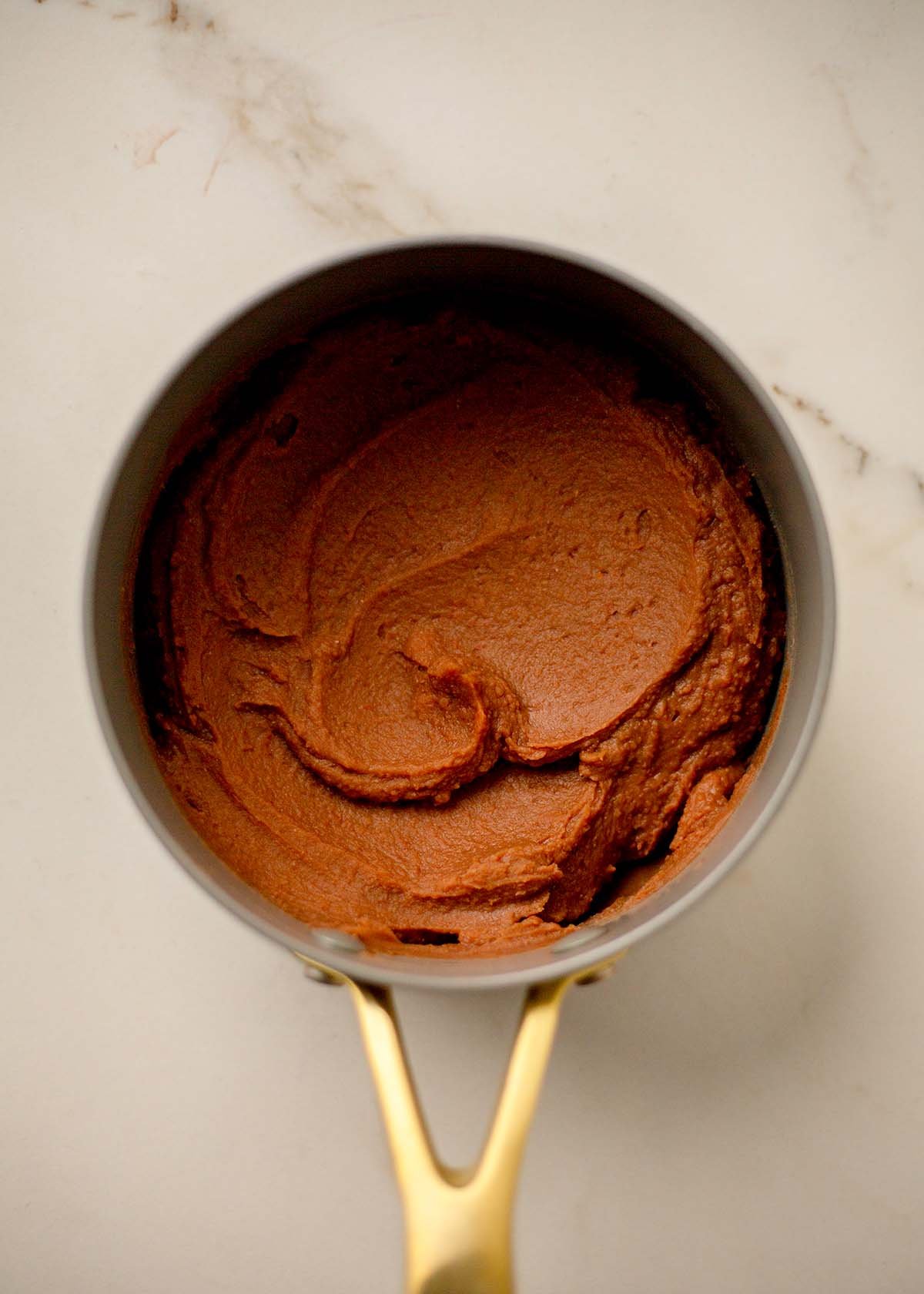 Warm refried beans in a pot