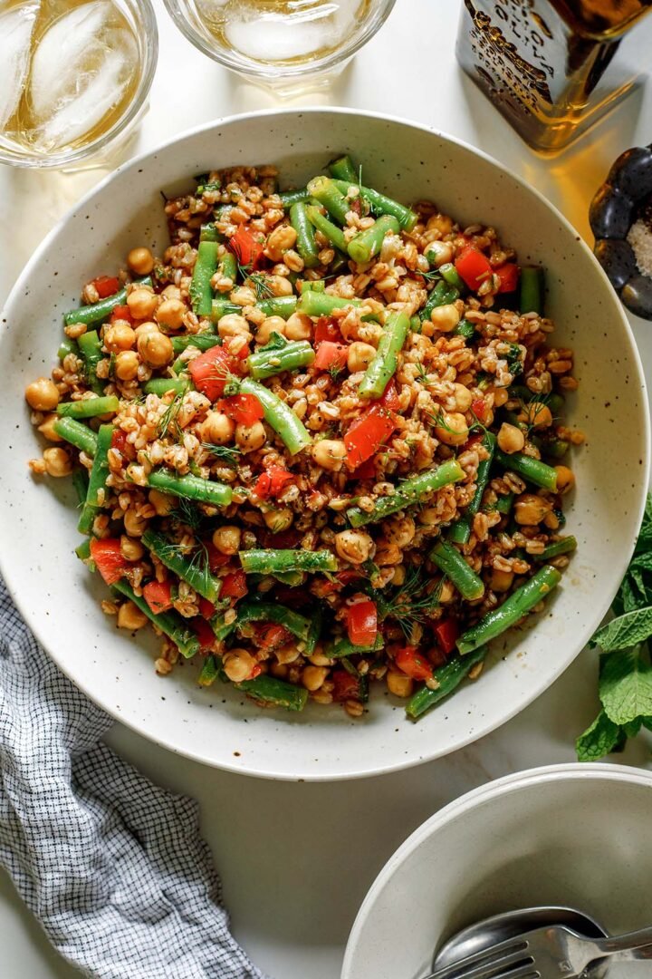 A vibrant Farro Salad with chickpeas, fresh green beans, and herbs