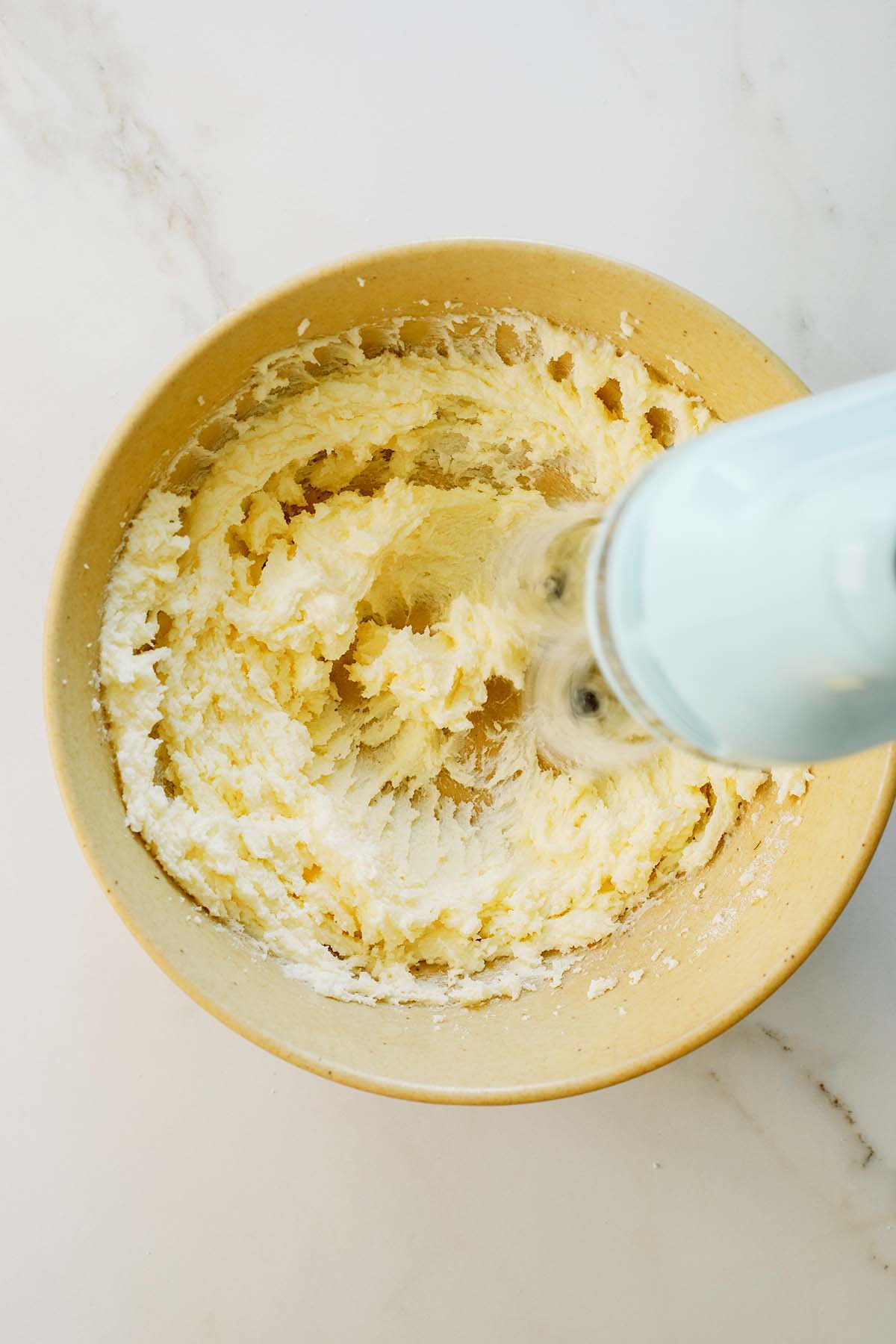 Butter and sugar creamed until pale and fluffy in a large bowl.