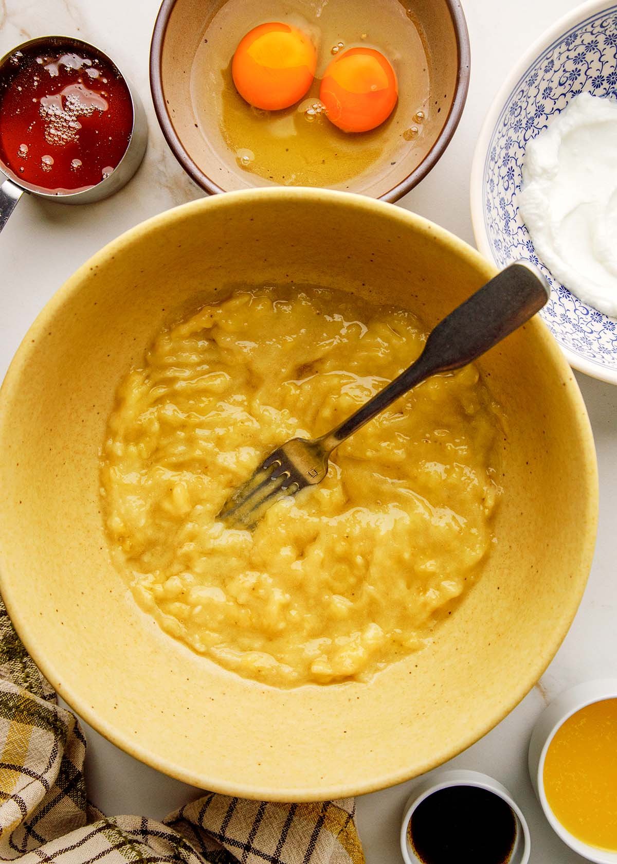 Mashed Banana in a Big Yellow Bowl