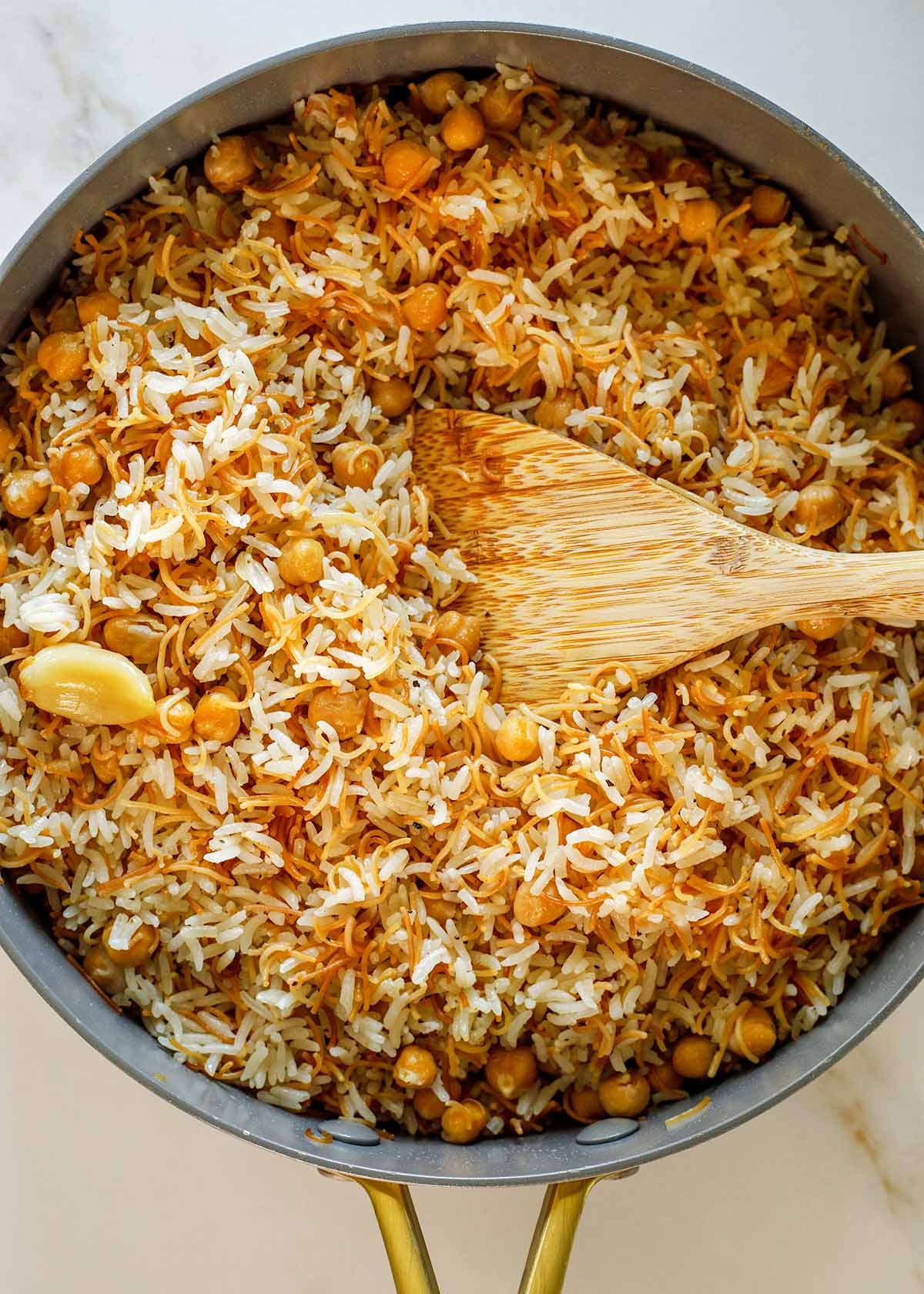 Vermicelli Rice with Chickpeas in Pan with Wooden Spoon