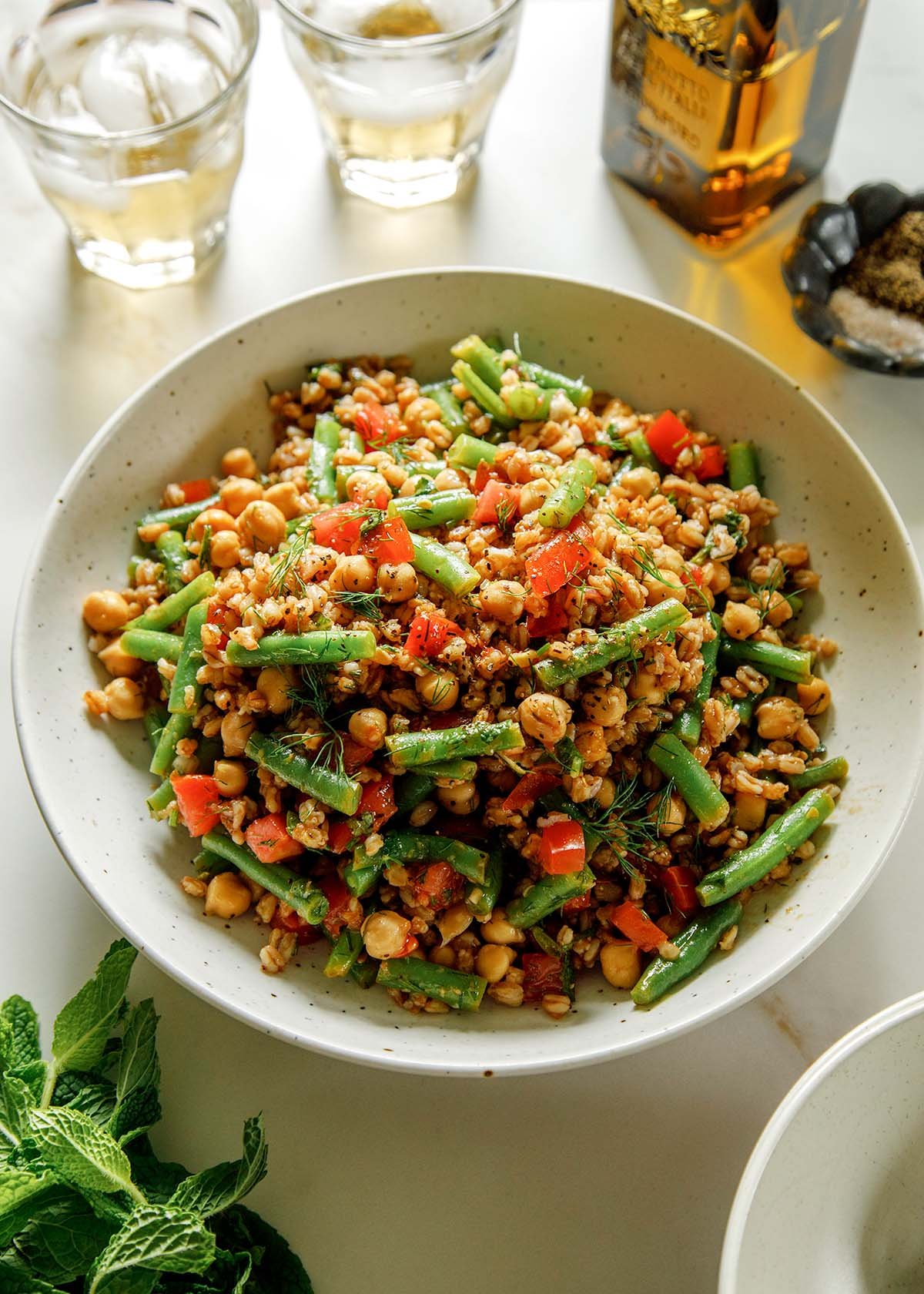 Farro salad in a white bowl